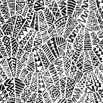 Seamless geometric pattern. Ornament in patchwork style. Grunge texture. Ethnic and tribal motifs. Black and white print.