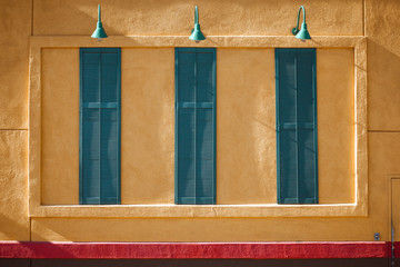 Bright facade of the building with shutters