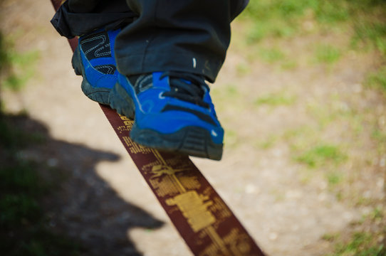 Child walking on a tightrope