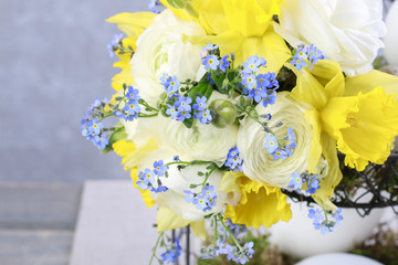 Bouquet of daffodils, forget me not and ranunculus flowers.