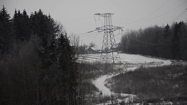 Power lines in the snow. Cogeneration plant in a strong blizzard