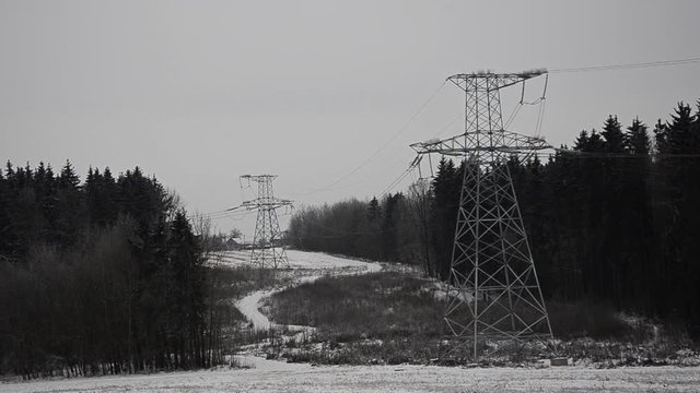 Power lines in the snow. Cogeneration plant in a strong blizzard