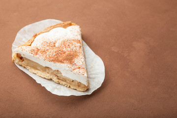 Sweet dessert on a brown background, empty space for text.