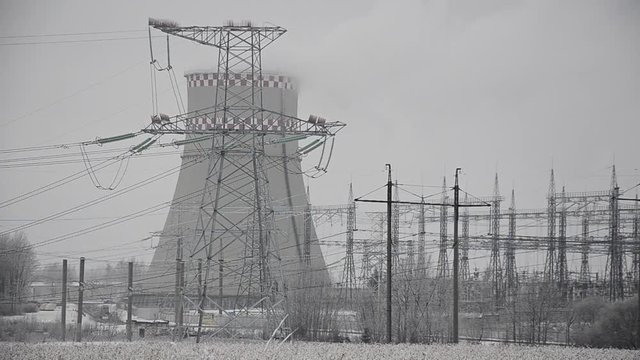 Power lines in the snow. Cogeneration plant in a strong blizzard
