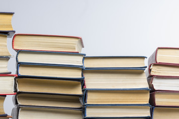 Stack of books background. many books piles.