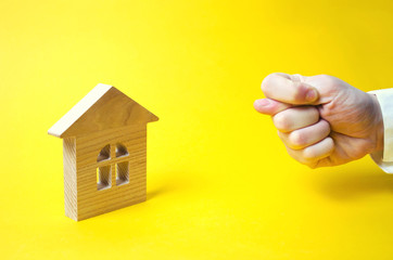 The hand shows a gross gesture of the house, property, business. Hard refusal, disgust. A rude...