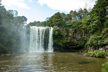 Hidden Cave Leading Under New Zealand Waterfall 