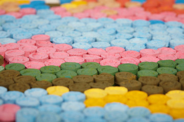 Detail of pills of MDMA (Extasy) distributed by drug dealer seized by legal authority