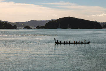 Maori In Waka At Sunrise On Traditional Waitangi Day 