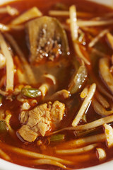 A bowl of the Thai classic, Tom Yum soup with chicken