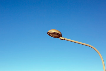 Streetlight with blue sky background.