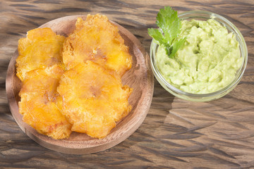 Fried plantain tostón. Patacon - Musa × paradisiaca