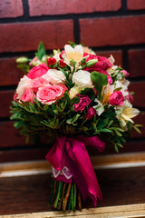 beautiful wedding bouquet with pink roses and white flowers close up