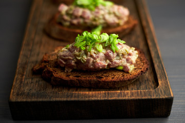 bruschetta, on slices of toasted baguette garnished with basil