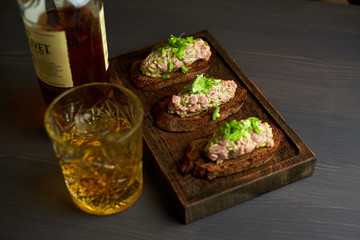 bruschetta, on slices of toasted baguette garnished with basil