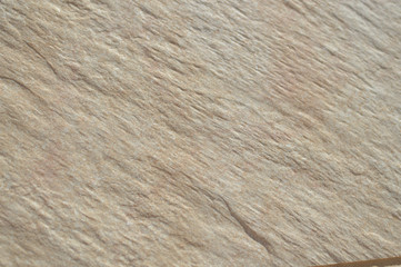 Closeup on ceramic tile detailed surface rough marbled textured background