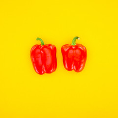 top view of fresh red paprika peppers isolated on yellow