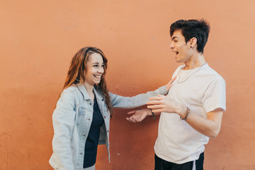 Couple in love having a good time. Couple having fun. Young lovers enjoying a sunny day.