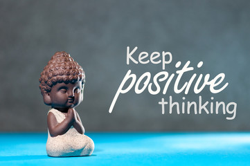 Keep Positive thinking - motivating and inspiring concept with meditating little buddha