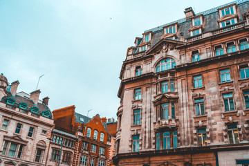 Fototapeta premium some orange facaded residential houses in a street at london