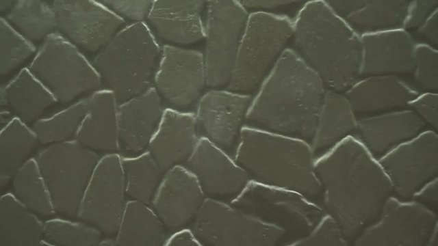 Artificial waterfall on the background of stone wall stock footage video