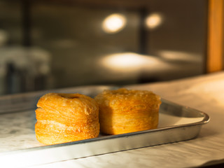 Croissants or pastries in glass cabinet in the bakery shop, homemade style bakery with flour, sugar, butter and baked in an oven, for dessert, bakery, breakfast 