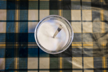 Fototapeta na wymiar jar of sugar on table seen from above