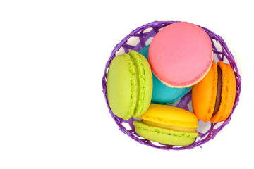 colorful macaroons in a bamboo basket