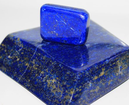 Lapis Lazuli gemstone on a white background