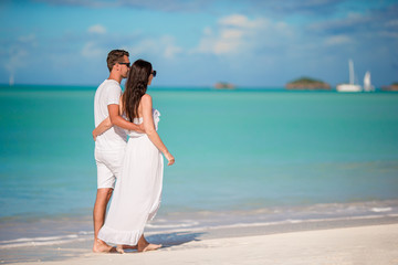 Family of two walking on the beach