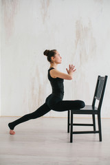 Young beautiful woman practicing yoga and gymnastic. Wellness concept. Classes in single sports.