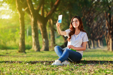 woman using mobile phone in park