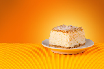 Delicious cake on colorful background with copyspace