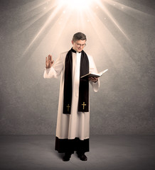 young priest in giving his blessing
