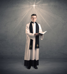 young priest in giving his blessing