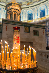 ISTRA, RUSSIA - JANUARY 3, 2017: Candles near chapel of the Holy Sepulchre in the Voskresensky...