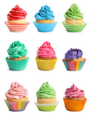 Set of tasty colorful cupcakes on white background