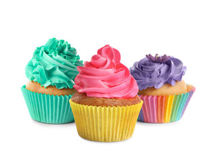 Set of tasty colorful cupcakes on white background