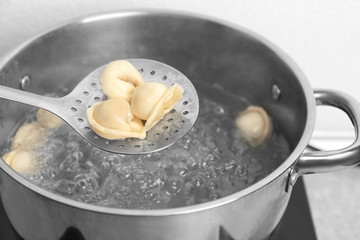 Cooking dumplings in boiling water, closeup