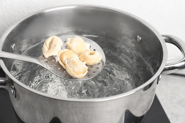 Cooking dumplings in boiling water, closeup
