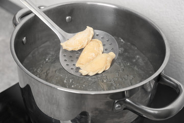 Cooking dumplings in boiling water, closeup