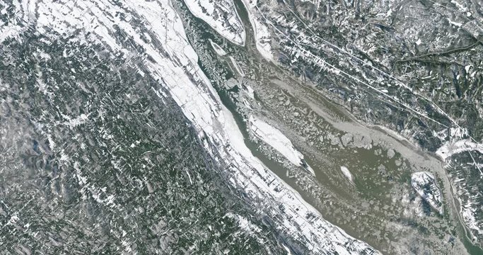 Very high-altitude overflight aerial of St. Lawrence River, Canada, in winter. Clip loops and is reversible. Elements of this image furnished by USGS/NASA Landsat