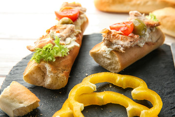 Slate plate with tasty chicken bruschettas, closeup