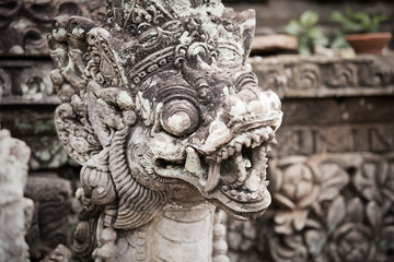 Fototapeta na wymiar Traditional ancient sculpture of temple in Bali, Indonesia