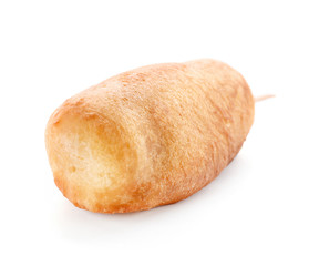 Tasty corn dog on white background