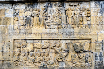 Detail of Buddhist carved relief in Borobudur temple in Yogyakarta, Java, Indonesia