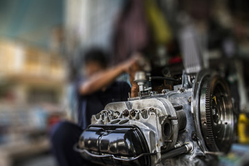 Fototapeta na wymiar The technician assemble the car engine type horizontally 