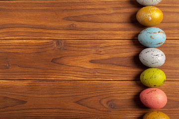 Happy easter! Easter eggs on wooden background