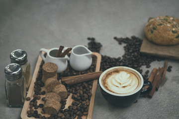 Fototapeta na wymiar Morning coffee,Latte coffee in cup on table,vintage tone.