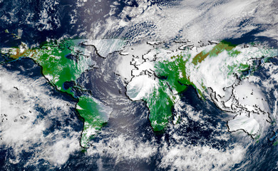 Hurricane over the green world map silhouette, elements of this image furnished by NASA. Concept of...